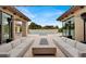 Beautiful outdoor patio features comfortable seating, modern fire pit, and a gorgeous swimming pool at 20 Pebble Hills Ct, Las Vegas, NV 89141