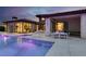 Captivating backyard featuring a pool, spa, and an outdoor dining area perfect for entertaining guests at 20 Pebble Hills Ct, Las Vegas, NV 89141