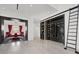 Stylish custom wine cellar with ladder access, and dining room view at 20 Pebble Hills Ct, Las Vegas, NV 89141