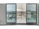 Balcony with sliding glass doors offering expansive city and mountain views at 200 Hoover Ave # 1507, Las Vegas, NV 89101