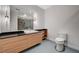 Bright bathroom with light cabinets, modern fixtures, and glass enclosed shower at 200 Hoover Ave # 1507, Las Vegas, NV 89101