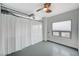 Modern bedroom boasts large windows, a ceiling fan, and unique exposed ductwork at 200 Hoover Ave # 1507, Las Vegas, NV 89101