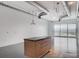 Bright living room with a kitchen island, large windows with city views at 200 Hoover Ave # 1507, Las Vegas, NV 89101