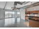 Open concept living space features concrete floors, city views, and modern kitchen at 200 Hoover Ave # 1507, Las Vegas, NV 89101