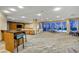 Spacious lounge with comfortable seating, a bar, and large windows offering city views at 200 Hoover Ave # 1507, Las Vegas, NV 89101