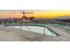 Beautiful rooftop pool with a panoramic city view and vibrant sunset, perfect for relaxation and enjoyment at 200 Hoover Ave # 1507, Las Vegas, NV 89101