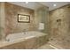 Bathroom featuring walk-in shower and large soaking tub at 2000 N Fashion Show Dr # 3921, Las Vegas, NV 89109