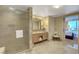 Bathroom boasts glass shower, marble floors, and double vanity at 2000 N Fashion Show Dr # 3921, Las Vegas, NV 89109