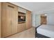 Bedroom features custom built-ins, storage, shelving and a television at 2000 N Fashion Show Dr # 3921, Las Vegas, NV 89109