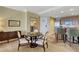 Comfortable dining area with sleek table and comfortable seating with view into kitchen at 2000 N Fashion Show Dr # 3921, Las Vegas, NV 89109