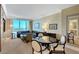Open concept living and dining space with a wall of windows and city views at 2000 N Fashion Show Dr # 3921, Las Vegas, NV 89109