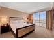 Serene bedroom with a king-sized bed, floor-to-ceiling windows offering views, and elegant furnishings at 2000 N Fashion Show Dr # 3921, Las Vegas, NV 89109