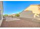 Desert landscaped backyard with a charming fire pit and ample space for outdoor activities at 2186 Savannah River St, Henderson, NV 89044