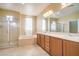 Bright bathroom features double sinks, a shower, and a separate soaking tub at 2186 Savannah River St, Henderson, NV 89044