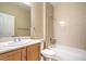 Bright bathroom features a vanity, a toilet, and a shower-tub combination at 2186 Savannah River St, Henderson, NV 89044