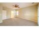 Bright bedroom with neutral walls features a ceiling fan and large window at 2186 Savannah River St, Henderson, NV 89044