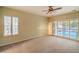 Comfortable bedroom with neutral carpet, ceiling fan, and natural light from windows at 2186 Savannah River St, Henderson, NV 89044