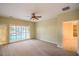 Spacious bedroom features a ceiling fan and sliding glass doors to the backyard at 2186 Savannah River St, Henderson, NV 89044