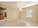 Neutral dining room with tile flooring, chandelier lighting and plantation shutters at 2186 Savannah River St, Henderson, NV 89044
