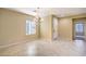 Neutral dining room with tile flooring, chandelier lighting and plantation shutters at 2186 Savannah River St, Henderson, NV 89044
