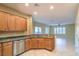 Open kitchen with stainless appliances and granite counters that transitions to living area at 2186 Savannah River St, Henderson, NV 89044