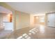Open floorplan, showing neutral living room, tile flooring and kitchen bar at 2186 Savannah River St, Henderson, NV 89044