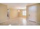 Spacious living room with tile flooring, neutral paint and chandelier lighting at 2186 Savannah River St, Henderson, NV 89044