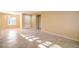 Living room featuring tile flooring, neutral paint, plantation shutters and front door at 2186 Savannah River St, Henderson, NV 89044