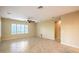 Spacious living room featuring tile floors, neutral walls, and modern ceiling fan at 2186 Savannah River St, Henderson, NV 89044