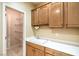 Practical utility sink with storage and shelving at 2186 Savannah River St, Henderson, NV 89044