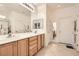 Bright bathroom with double sink vanity, tile floors and updated fixtures at 2384 Yellow Bird Ct, North Las Vegas, NV 89084