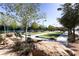 Inviting bocce ball court surrounded by landscaped greenery, providing a serene space for outdoor games and enjoyment at 2384 Yellow Bird Ct, North Las Vegas, NV 89084