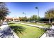 Bocce ball court, framed by lush greenery, offers a picturesque setting for outdoor recreation and leisure at 2384 Yellow Bird Ct, North Las Vegas, NV 89084
