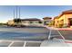Well-maintained building with manicured landscape and ample parking, showcasing an inviting curb appeal at 2384 Yellow Bird Ct, North Las Vegas, NV 89084