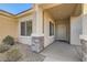 Inviting front porch with stone accents, providing a warm welcome to the home at 2384 Yellow Bird Ct, North Las Vegas, NV 89084