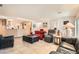 Comfortable living room showcasing tile flooring, ample seating, and an open layout at 2384 Yellow Bird Ct, North Las Vegas, NV 89084