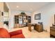 Home office offers built-in shelves, an organized desk space and a relaxing lounge at 2384 Yellow Bird Ct, North Las Vegas, NV 89084