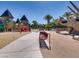 Community playground featuring slides, play structures, and seating areas at 2384 Yellow Bird Ct, North Las Vegas, NV 89084