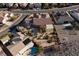 An aerial view displaying a home with desert landscaping, a covered patio, and surrounding neighborhood at 2401 Orangeburg Pl, Henderson, NV 89044
