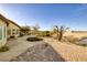Spacious backyard with desert landscaping, brickwork, and scenic views at 2401 Orangeburg Pl, Henderson, NV 89044