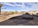 Multi-tiered brickwork patio in a desert landscaped backyard at 2401 Orangeburg Pl, Henderson, NV 89044