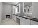 Modern bathroom with dual sinks, sleek cabinetry, a fireplace, and stylish lighting, creating a spa-like retreat at 2590 Luke St, Pahrump, NV 89060