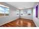 Spacious bedroom with hardwood floors, multiple windows providing scenic views and lots of natural light at 2590 Luke St, Pahrump, NV 89060