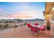 Enjoy outdoor dining on the wooden deck with mountain views at sunset at 2590 Luke St, Pahrump, NV 89060