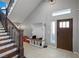 Welcoming entryway with a hall tree and staircase, offering a warm and inviting atmosphere at 2590 Luke St, Pahrump, NV 89060