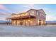 Spacious property with multiple garage doors and an upper deck at 2590 Luke St, Pahrump, NV 89060