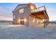 Unique home design featuring an upper deck and multiple garage spaces at 2590 Luke St, Pahrump, NV 89060