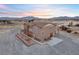 This charming two-story home has a front patio and a two-car garage at 2590 Luke St, Pahrump, NV 89060