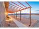 Walkway with pergola and landscape lighting with mountain views at 2590 Luke St, Pahrump, NV 89060