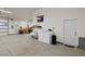 Well-equipped garage space includes a laundry area, workbench, and access to the outdoors at 2590 Luke St, Pahrump, NV 89060